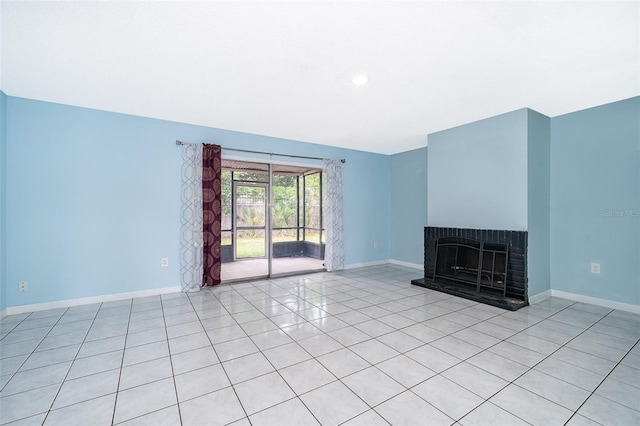 5060 Downing St Unit 6, Orlando, FL 32839 - unfurnished living room featuring baseboards, a fireplace, and light tile patterned floors