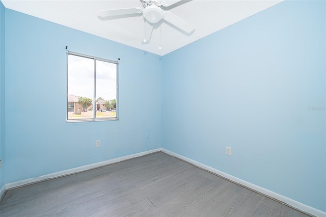 5060 Downing St Unit 6, Orlando, FL 32839 - unfurnished room with wood finished floors, baseboards, and ceiling fan