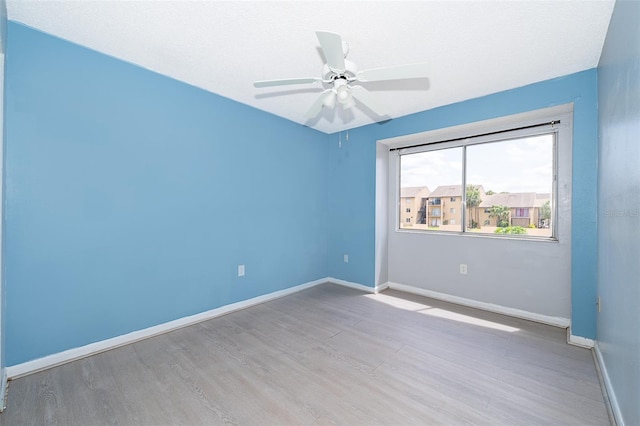 5060 Downing St Unit 6, Orlando, FL 32839 - unfurnished room featuring wood finished floors, baseboards, and a ceiling fan