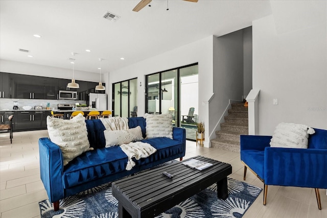 235 Villa Domani Cir, Davenport, FL 33896 - living room featuring ceiling fan, stairway, recessed lighting, and light tile patterned floors