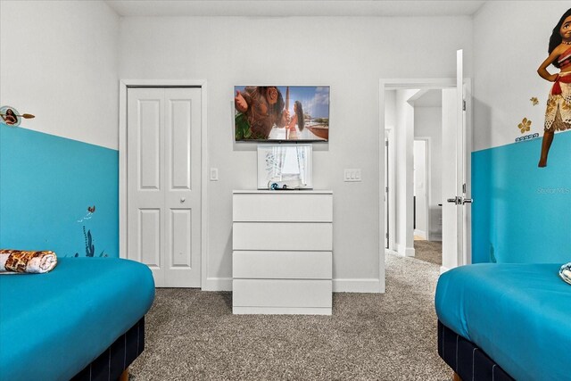 235 Villa Domani Cir, Davenport, FL 33896 - carpeted bedroom featuring baseboards and a closet