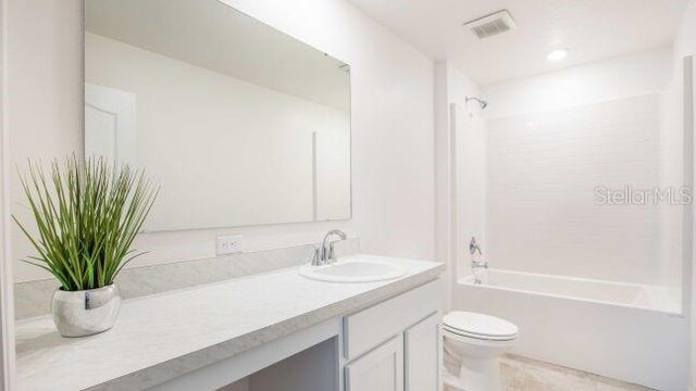114 Tulip Ln, Poinciana, FL 34759 - full bathroom with shower / tub combination, visible vents, toilet, and vanity