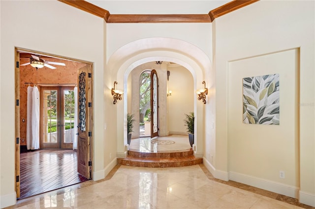 3412 Lilas Ct, Windermere, FL 34786 - entryway with arched walkways, plenty of natural light, baseboards, and marble finish floor