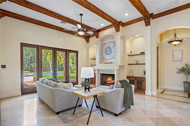 3412 Lilas Ct, Windermere, FL 34786 - living area with ceiling fan, beamed ceiling, a fireplace, visible vents, and built in shelves