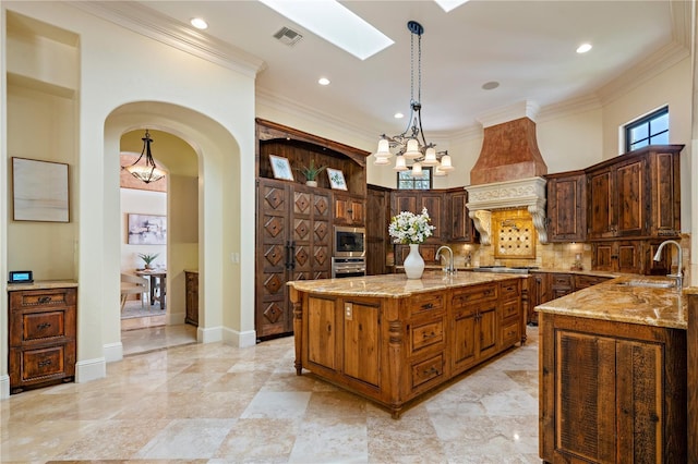 3412 Lilas Ct, Windermere, FL 34786 - kitchen with a sink, appliances with stainless steel finishes, premium range hood, decorative backsplash, and light stone counters