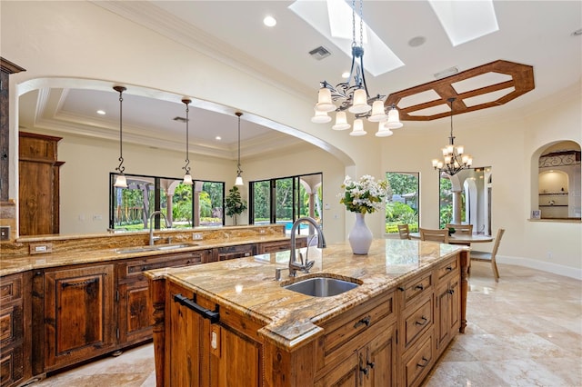 3412 Lilas Ct, Windermere, FL 34786 - kitchen featuring an inviting chandelier, visible vents, a sink, and ornamental molding