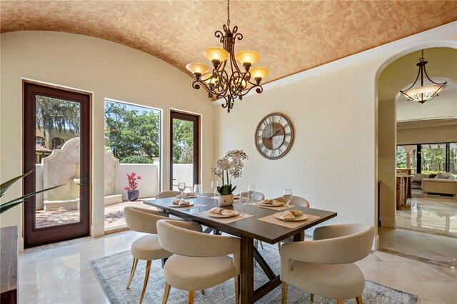 3412 Lilas Ct, Windermere, FL 34786 - dining area featuring arched walkways, a notable chandelier, marble finish floor, and lofted ceiling