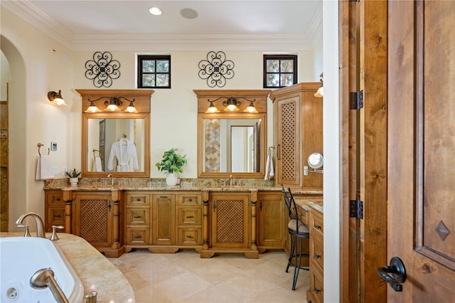 3412 Lilas Ct, Windermere, FL 34786 - bathroom featuring a whirlpool tub, double vanity, a sink, and crown molding