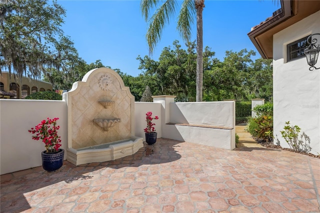 3412 Lilas Ct, Windermere, FL 34786 - view of patio featuring fence