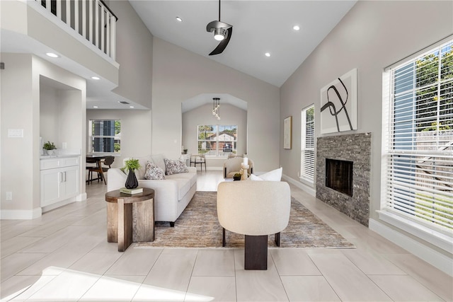 8616 Port Said St, Orlando, FL 32817 - living room with high vaulted ceiling, light tile patterned flooring, recessed lighting, and a fireplace