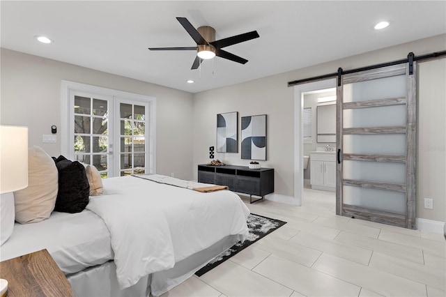 8616 Port Said St, Orlando, FL 32817 - bedroom featuring recessed lighting, baseboards, and a barn door