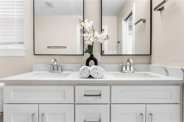 8616 Port Said St, Orlando, FL 32817 - full bath featuring double vanity, visible vents, and a sink