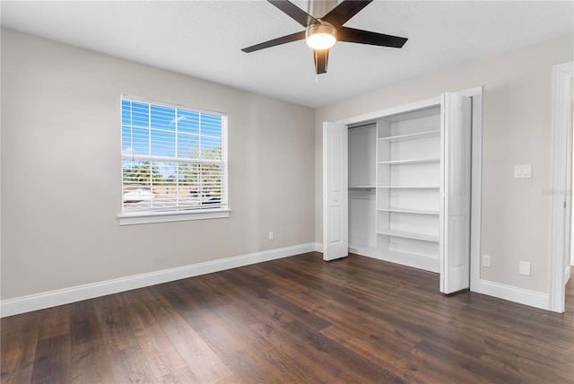 8616 Port Said St, Orlando, FL 32817 - unfurnished bedroom with dark wood-style flooring, a closet, baseboards, and ceiling fan