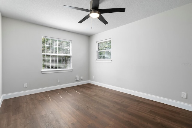 8616 Port Said St, Orlando, FL 32817 - unfurnished room with baseboards, a textured ceiling, ceiling fan, and dark wood-style floors