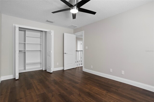 8616 Port Said St, Orlando, FL 32817 - unfurnished bedroom with visible vents, baseboards, a closet, a textured ceiling, and wood finished floors