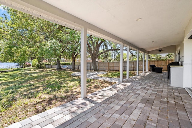 8616 Port Said St, Orlando, FL 32817 - view of patio with a fenced backyard and a ceiling fan