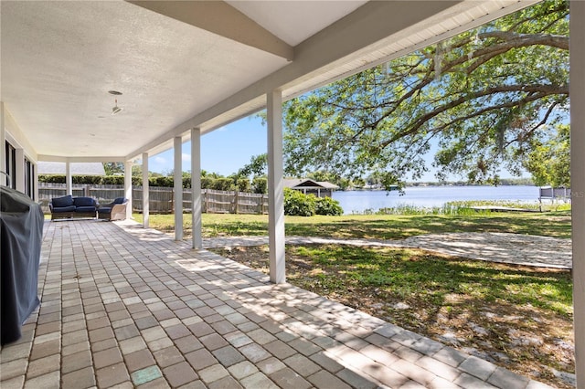 8616 Port Said St, Orlando, FL 32817 - view of patio / terrace with fence and a water view