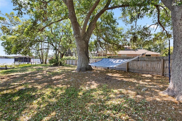 8616 Port Said St, Orlando, FL 32817 - view of yard featuring a water view and a fenced backyard