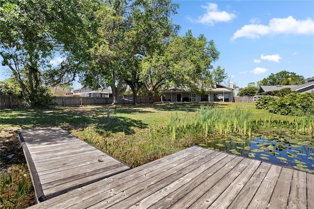 8616 Port Said St, Orlando, FL 32817 - dock area with a yard, a deck, and a fenced backyard