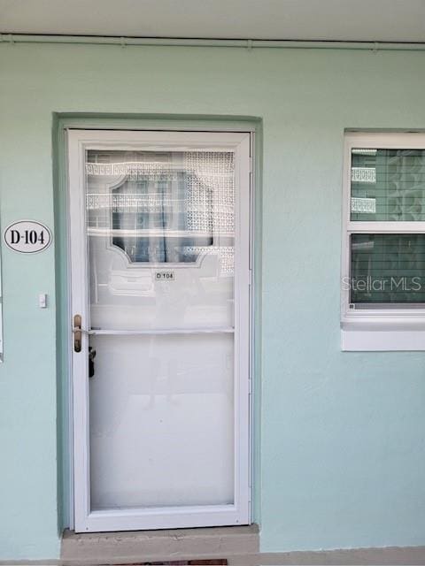325 N Causeway Unit D104, New Smyrna Beach, FL 32169 - entrance to property featuring stucco siding