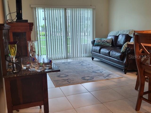 325 N Causeway Unit D104, New Smyrna Beach, FL 32169 - view of tiled living area