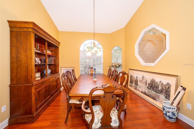 1709 Iverness Ct, Longwood, FL 32779 - dining area featuring baseboards, a chandelier, and wood finished floors