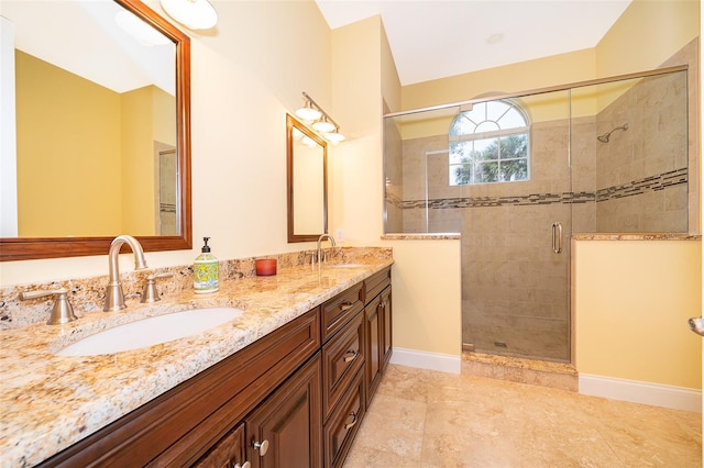 1709 Iverness Ct, Longwood, FL 32779 - bathroom featuring baseboards, double vanity, a sink, and a shower stall