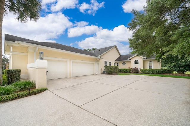 1709 Iverness Ct, Longwood, FL 32779 - view of property exterior with concrete driveway, stucco siding, and an attached garage
