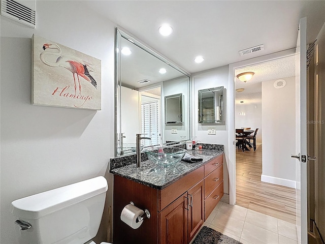 1581 Gulf Blvd Unit 102N, Clearwater Beach, FL 33767 - bathroom featuring vanity, tile patterned flooring, toilet, recessed lighting, and baseboards