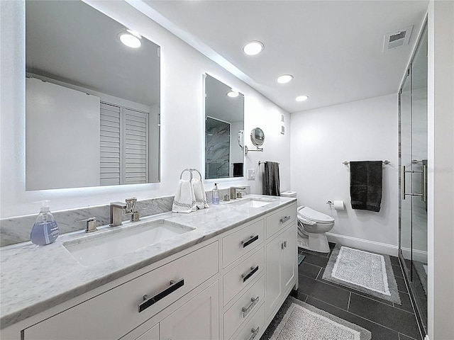 1581 Gulf Blvd Unit 102N, Clearwater Beach, FL 33767 - bathroom featuring double vanity, toilet, a shower stall, recessed lighting, and baseboards