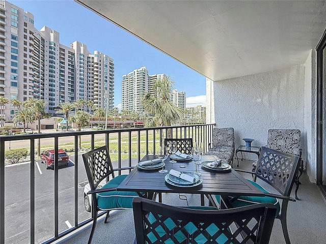 1581 Gulf Blvd Unit 102N, Clearwater Beach, FL 33767 - balcony featuring outdoor dining area and a city view