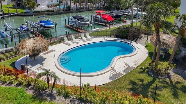 1581 Gulf Blvd Unit 102N, Clearwater Beach, FL 33767 - view of pool featuring boat lift, a boat dock, and a water view