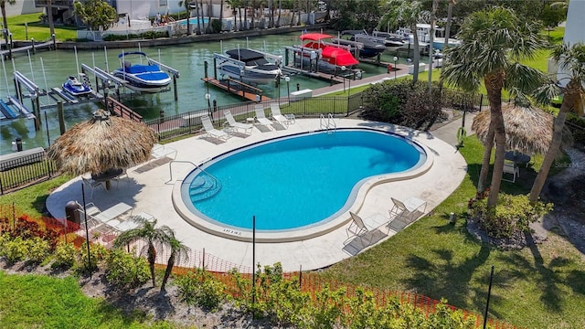 1581 Gulf Blvd Unit 102N, Clearwater Beach, FL 33767 - view of pool with boat lift, a dock, and a water view