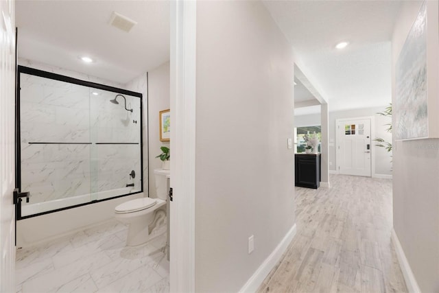 hall featuring marble finish floor, baseboards, visible vents, and recessed lighting