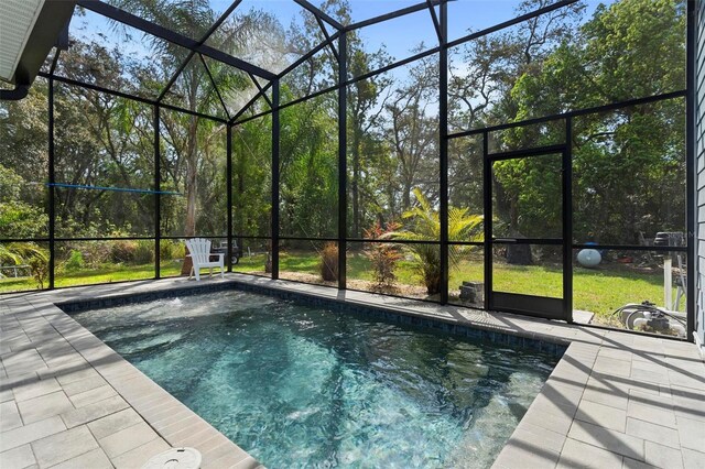 view of pool with a lanai and a patio area