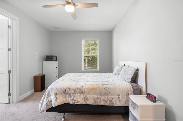 bedroom featuring baseboards, carpet, and a ceiling fan
