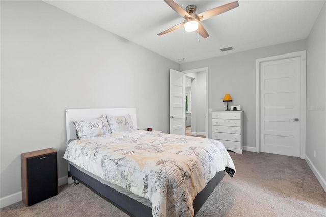 bedroom featuring baseboards, visible vents, carpet flooring, and a ceiling fan