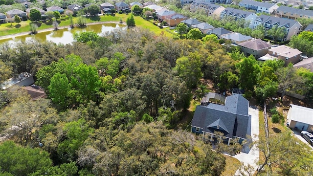 birds eye view of property with a residential view and a water view