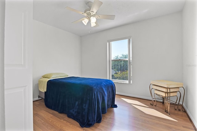 7606 Fordham Creek Ln, Orlando, FL 32818 - bedroom with wood finished floors and ceiling fan