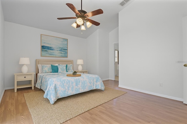 7606 Fordham Creek Ln, Orlando, FL 32818 - bedroom featuring vaulted ceiling, wood finished floors, and ceiling fan