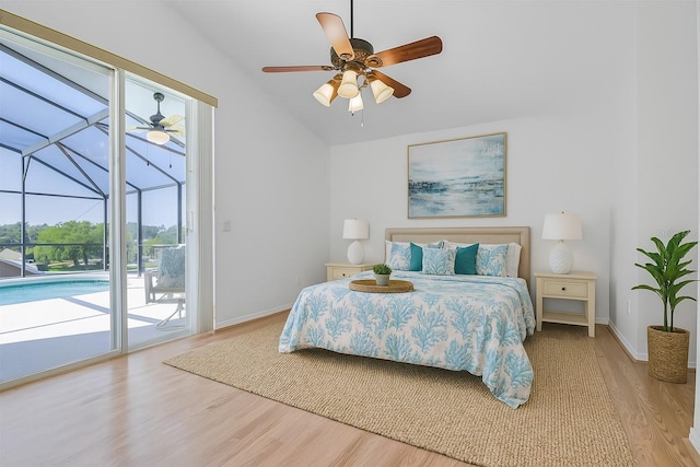 7606 Fordham Creek Ln, Orlando, FL 32818 - bedroom with access to exterior, wood finished floors, a sunroom, lofted ceiling, and ceiling fan