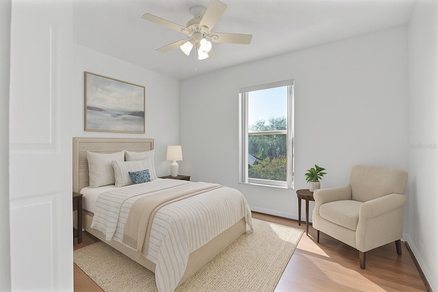7606 Fordham Creek Ln, Orlando, FL 32818 - bedroom with light wood-style flooring and a ceiling fan