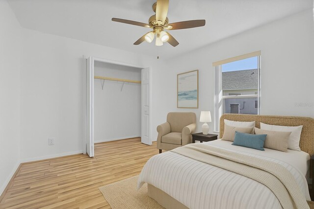 7606 Fordham Creek Ln, Orlando, FL 32818 - bedroom with light wood finished floors, a closet, and a ceiling fan