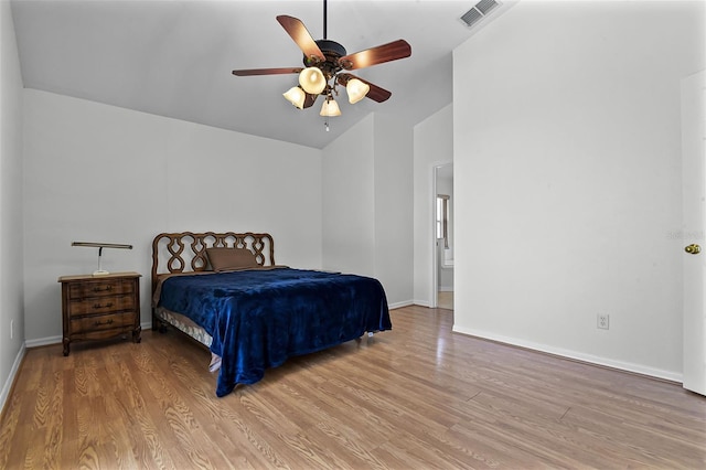 7606 Fordham Creek Ln, Orlando, FL 32818 - bedroom featuring vaulted ceiling, light wood-style floors, and a ceiling fan