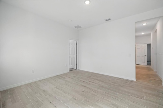 2152 Rock Maple Bnd, Kissimmee, FL 34746 - unfurnished room with light wood-style floors and recessed lighting