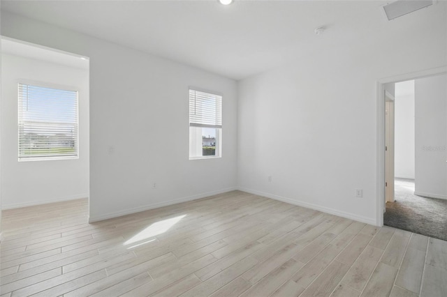 2152 Rock Maple Bnd, Kissimmee, FL 34746 - empty room featuring light wood finished floors and baseboards