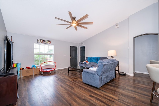 living room featuring visible vents, baseboards, a ceiling fan, and dark wood finished floors