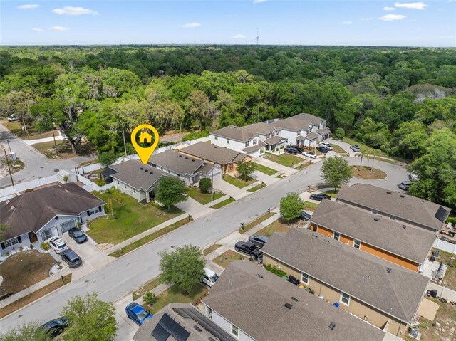 aerial view featuring a residential view and a view of trees
