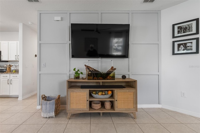 room details featuring decorative backsplash and visible vents