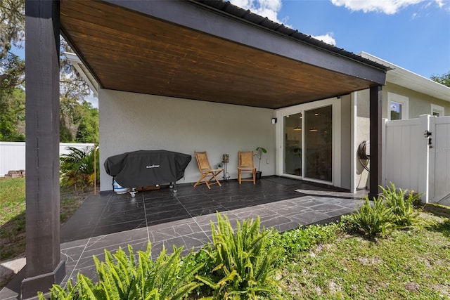 view of patio featuring fence